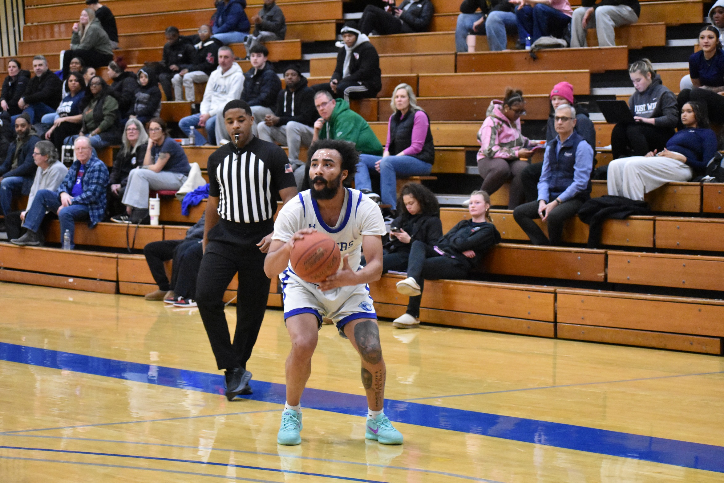 Men's basketball falls in OT